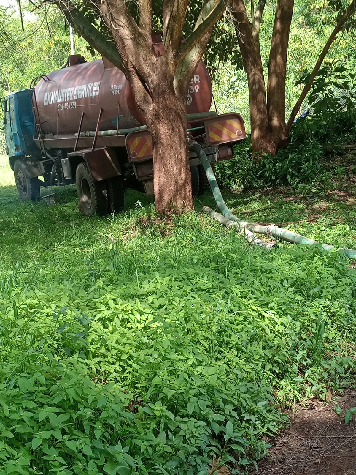 Exhauster truck emptying a septic tank